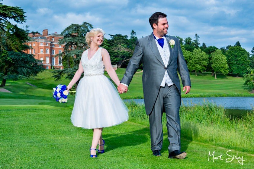 Bride and groom on the lawn at Brocket Hall - wedding at Brocket Hall - Mark Sisley Photography