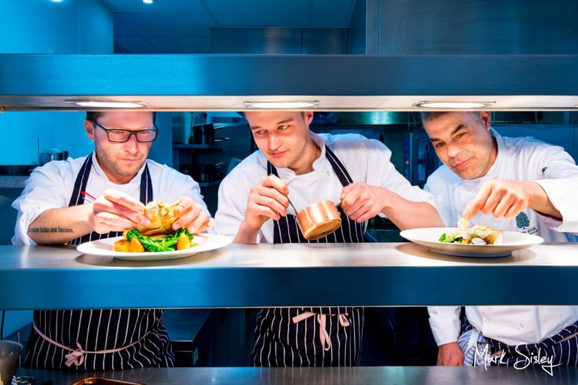 chefs plating food at corporate event - Mark Sisley Photography