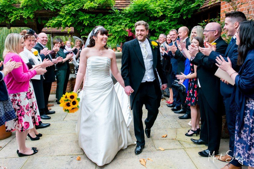 Bride and groom and wedding guests - wedding at The Dairy Waddesdon Manor - Mark Sisley Photography