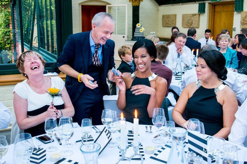 Magician and wedding guests - wedding at The Dairy Waddesdon - Mark Sisley Photography