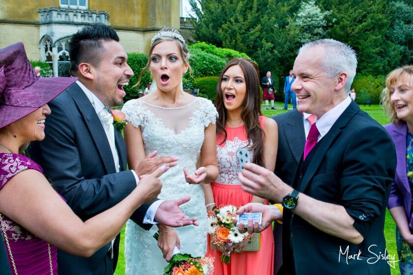 Magician and wedding guests - wedding at Missenden Abbey - Mark Sisley Photography