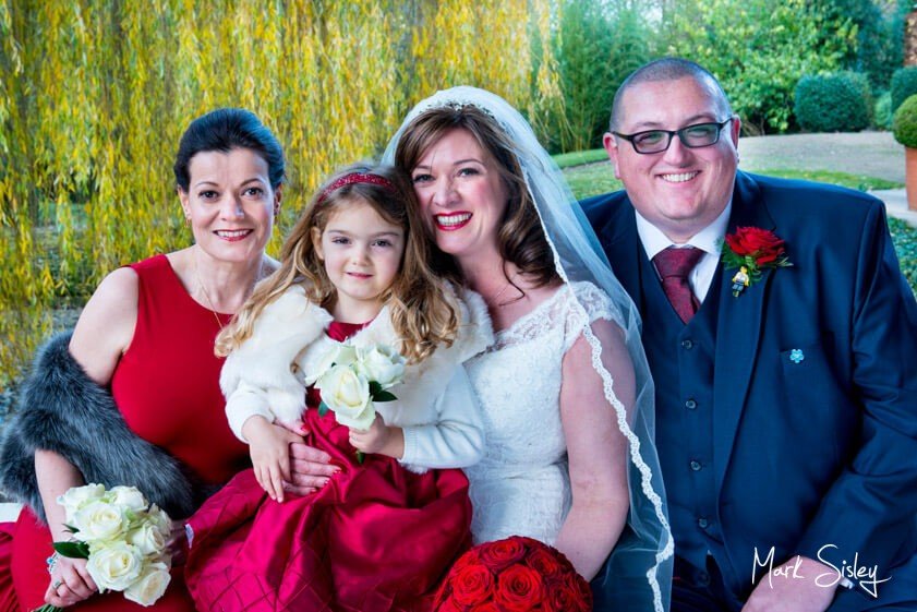 Bridal party with luxurious red roses at Waddesdon Manor - Mark Sisley Photography