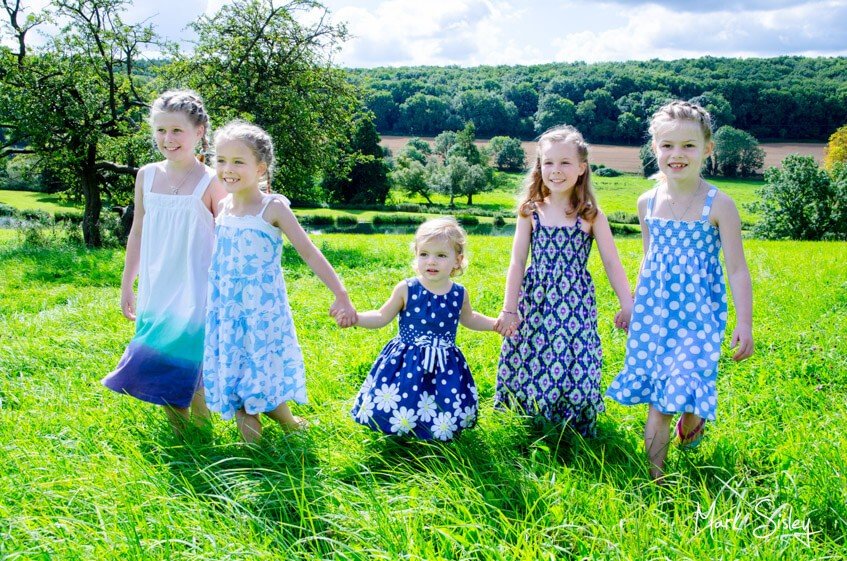 children playing in a meadow - family photograph - Mark Sisley Photography