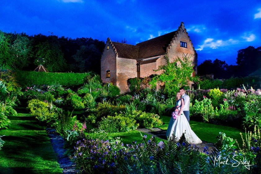 bride and groom at twilight - wedding at Chenies Manor House - Mark Sisley Photography