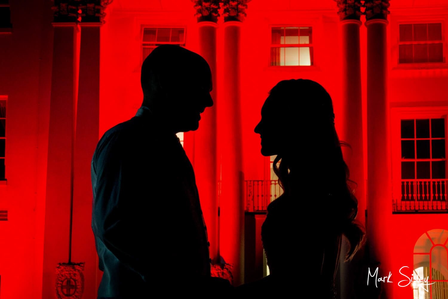 Beaumont Estate wedding photographs of the newlyweds with the floodlit building
