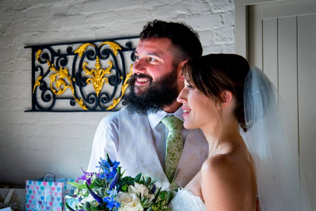 Five Arrows Hotel Waddesdon wedding photography of the newlyweds lit by directional light