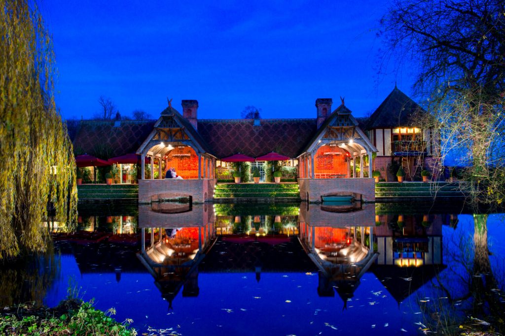 Dairy, Waddesdon Christmas wedding view across the lake at dusk