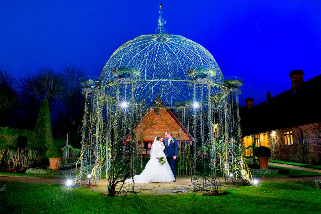 Waddesdon Dairy Christmas wedding pose after dusk with the rosary