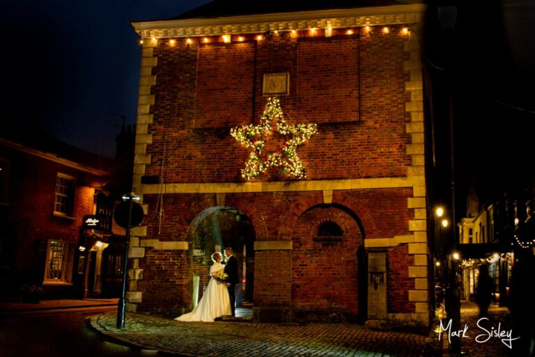 Amersham Christmas wedding couple venture into the High Street for some floodlit poses at The Kings Chapel reception in Old Amersham  