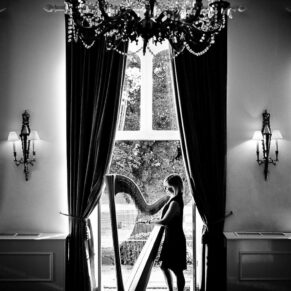 Black and white silhouette of Tori Handsley harpist at Taplow House Hotel wedding