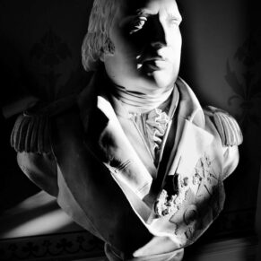 Black and white image of marble statue at Hartwell House Hotel wedding