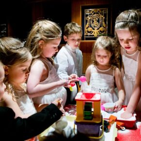 Buckinghamshire wedding photography of children - this adorable shot of the kids playing was captured at the Dairy on the Waddesdon Estate