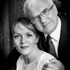 Black and white window-lit photography of bride and groom at Covent Garden Hotel wedding
