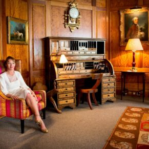 The bride posed in armchair at her atmospheric Covent Garden Hotel wedding reception