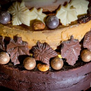 Buckinghamshire wedding detail photography - chocolate cake with dramatic lighting