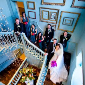 Bridal party on staircase at Stoke Place wedding