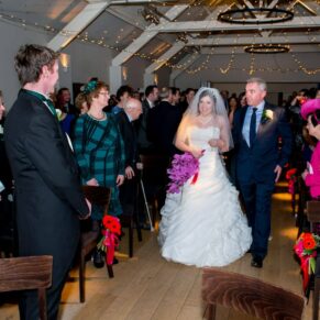 Bride and dad walking up the aisle at Stoke Place wedding