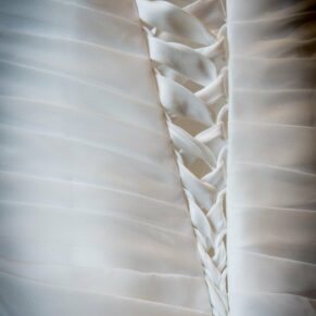 Detail of laces on back of wedding dress at Stoke Place wedding