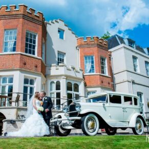 Bride and groom and classic car at Taplow House wedding