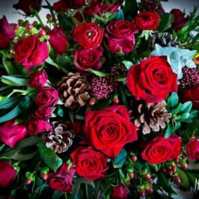 Red roses in bridal bouquet at Taplow House Hotel wedding