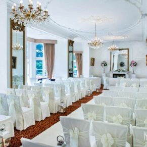 Photography of Taplow House hotel setup for wedding ceremony with a white theme