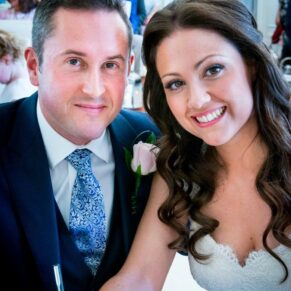 Bride and groom signing the register at Taplow House Hotel wedding