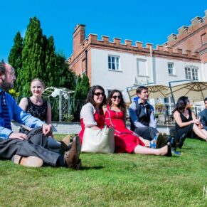 Wedding guests on lawn at Taplow House Hotel wedding