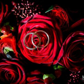 Red roses in bridal bouquet at Taplow House Hotel wedding