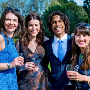 Guests relaxing on the grass at a Taplow House Hotel wedding