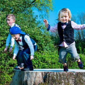 Children playing in the grounds of Taplow House Hotel at a wedding