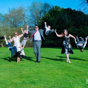 Wedding guests and children playing on the grass at a Taplow House Hotel wedding