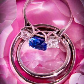 Close-up image of wedding rings on pink roses at Taplow House Hotel wedding