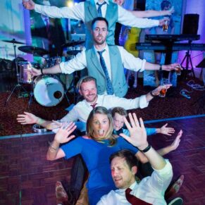 Informal fun image of wedding guests at Taplow House wedding