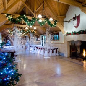 Ceremony and Christmas tree in West Hall at The Dairy Waddesdon Manor winter wedding