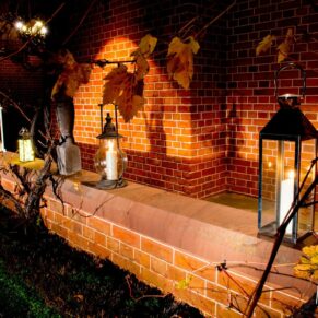 Candles in lanterns at The Dairy Waddesdon Manor winter wedding