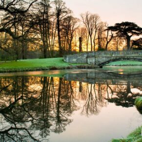 Sunrise across the lake at Hartwell House winter wedding