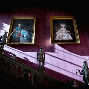 Staircase with oil paintings at Hartwell House winter wedding