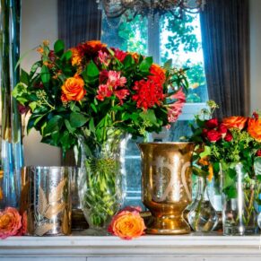 Floral arrangement in mirror at Taplow House Hotel winter wedding