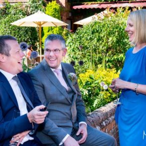 wedding guests laughing at The Five Arrows Waddesdon