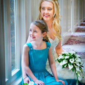Beaumont Estate wedding photographs of the bride sat down with her flower girl