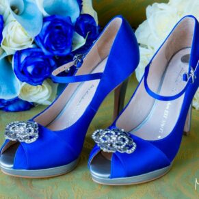 Brocket Hall wedding photographs of the bride's blue shoes on the cobbles