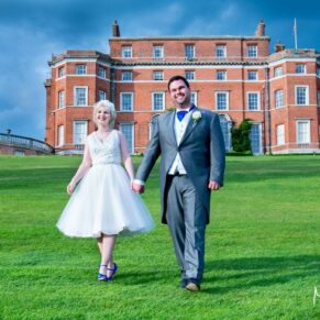 Brocket Hall wedding photographs of the newlyweds walking towards the camera