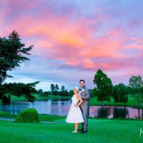 Brocket Hall wedding photographs of the newlyweds at sunset with views over the lake