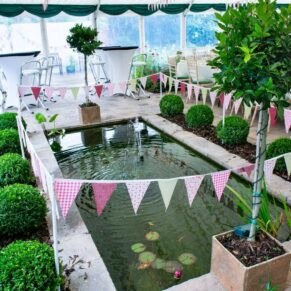 Buckinghamshire marquee wedding photography of a pond enclosure