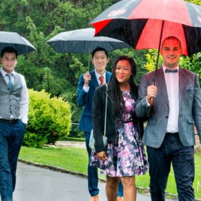 St. Mary's Church Chesham wedding photography of the guests arriving in the rain