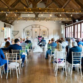 Five Arrows Hotel Waddesdon wedding photography of the ceremony in progress in the Old Coach House