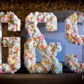 Summer's day wedding photography at Missenden Abbey - giant floral letters