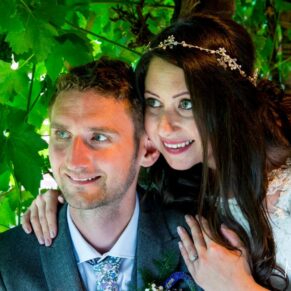 Dairy Waddesdon wedding photos of the newlyweds by the grape vines