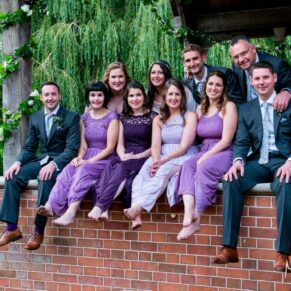 Dairy Waddesdon wedding photos of the guests sat on the edge of the pavilion