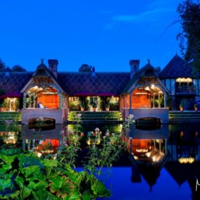 Dairy Waddesdon wedding photos across the lake at dusk